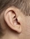 Image of a person wearing an invisible in canal hearing aid